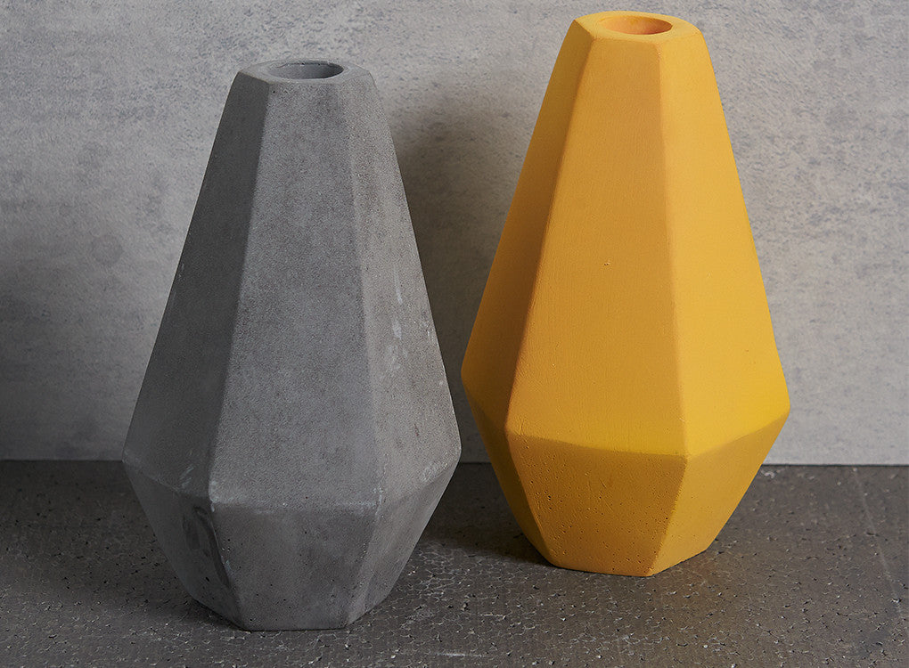 Geometric Concrete Candle Holders in grey and curry yellow by Korridor Design
