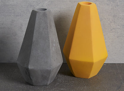 Geometric Concrete Candle Holders in grey and curry yellow by Korridor Design