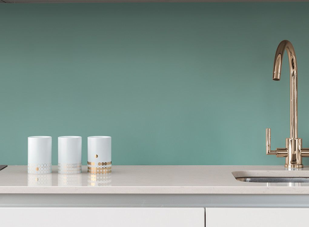 Portobello contemporary design insulated gold mugs on a kitchen worktop by THABTO 